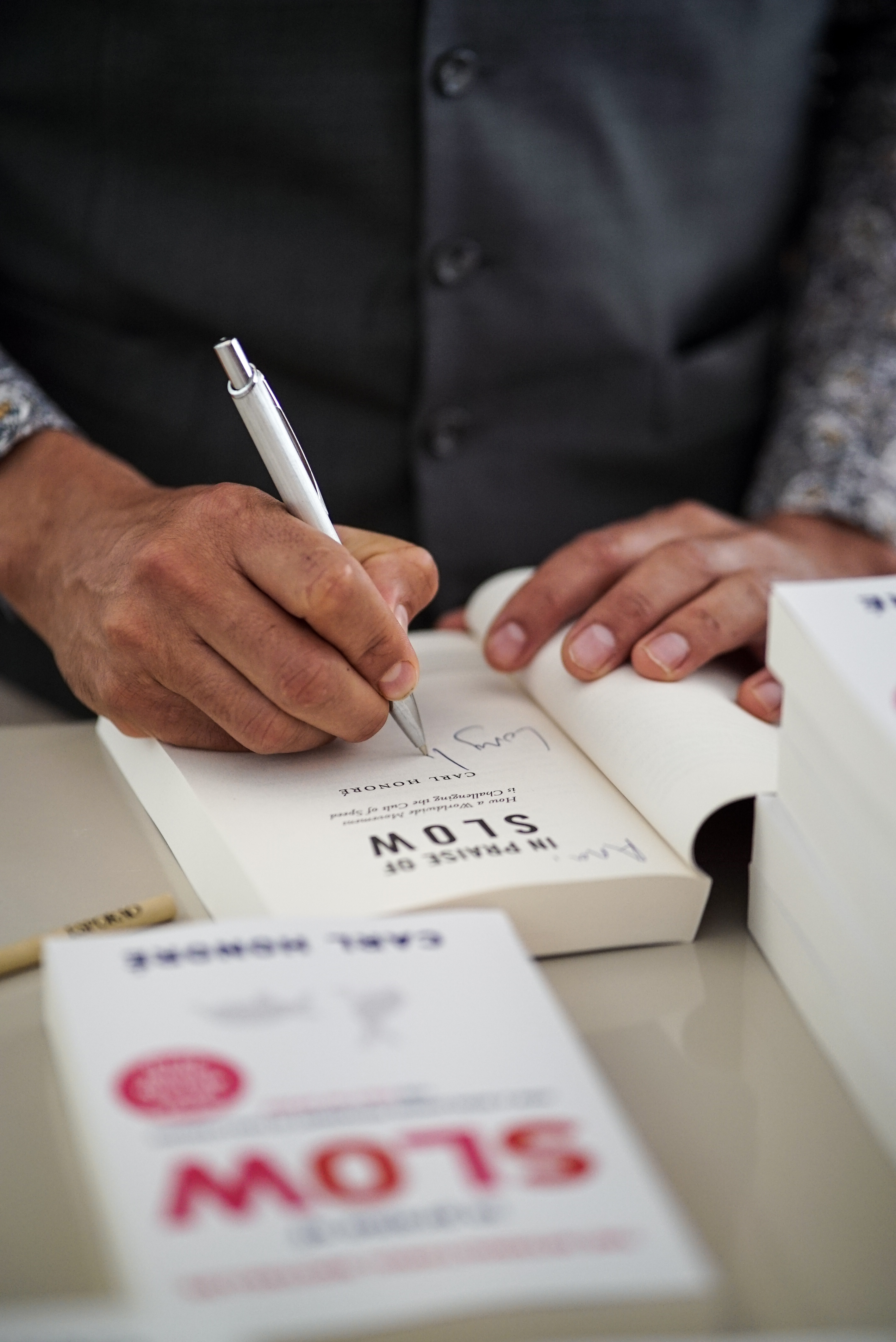 Carl Honoré signing The Praise Of Slow